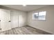 Bright bedroom with wood-look floors and ample closet space at 2120 Waitman Ave, Leesburg, FL 34748