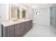 Modern bathroom with double vanity, large shower, and marble flooring at 2247 King Edwards Ct, Winter Park, FL 32792