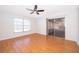 Bedroom with sliding door to screened porch and wood floors at 2247 King Edwards Ct, Winter Park, FL 32792