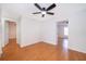 Hardwood floor hallway with doors to bedrooms at 2247 King Edwards Ct, Winter Park, FL 32792