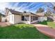 Exterior view of house with screened porch and yard at 2247 King Edwards Ct, Winter Park, FL 32792