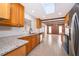 Modern kitchen with granite countertops and wooden cabinets at 2247 King Edwards Ct, Winter Park, FL 32792