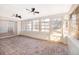 Bright sunroom featuring brick flooring and ceiling fans at 2247 King Edwards Ct, Winter Park, FL 32792