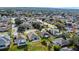 Bird's eye view of houses, roads, and a lake at 2446 Leaning Pine Ln, Oviedo, FL 32765