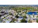 Aerial view of houses, streets, and a pond at 2446 Leaning Pine Ln, Oviedo, FL 32765