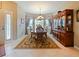 Elegant dining area with wood furniture and neutral decor at 2446 Leaning Pine Ln, Oviedo, FL 32765