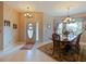 Formal dining room with wood table and bay window at 2446 Leaning Pine Ln, Oviedo, FL 32765