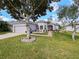 One-story house with gray siding and landscaping at 2446 Leaning Pine Ln, Oviedo, FL 32765