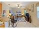 Living room features a ceiling fan, comfy couch, and tile flooring at 2446 Leaning Pine Ln, Oviedo, FL 32765