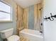 Updated bathroom with tub and tiled shower surround at 2511 Madron Ct, Orlando, FL 32806