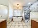 Spa-like bathroom with soaking tub, walk-in shower and tile flooring at 2511 Madron Ct, Orlando, FL 32806