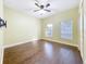 Bright bedroom with hardwood floors and two windows at 2511 Madron Ct, Orlando, FL 32806