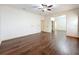 Spacious bedroom with hardwood floors and door to hallway at 2511 Madron Ct, Orlando, FL 32806