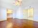 Large bedroom with hardwood floors and ceiling fan at 2511 Madron Ct, Orlando, FL 32806