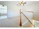 Bright loft area with carpet flooring, and staircase at 2511 Madron Ct, Orlando, FL 32806