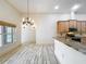 Kitchen dining area with wood-look tile floor at 2511 Madron Ct, Orlando, FL 32806