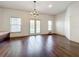 Bright dining room with hardwood floors and french doors to patio at 2511 Madron Ct, Orlando, FL 32806