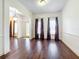 Formal dining room with hardwood floors, chandelier, and large windows at 2511 Madron Ct, Orlando, FL 32806