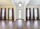 Formal dining room with hardwood floors, chandelier, and large windows at 2511 Madron Ct, Orlando, FL 32806