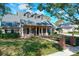 Two-story home with brick facade, gray roof, and landscaped lawn at 2511 Madron Ct, Orlando, FL 32806