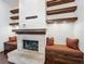 Fireplace with built-in seating and wood mantel at 2511 Madron Ct, Orlando, FL 32806