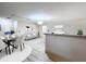Spacious living room with stylish furniture, dining area, and wood-look tile floors at 2511 Madron Ct, Orlando, FL 32806