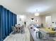 Open floor plan with dining area, seating, kitchen bar and tile flooring throughout at 2511 Madron Ct, Orlando, FL 32806