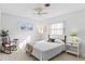 Cozy bedroom with a full-size bed and a rocking chair at 2823 Cady Way, Winter Park, FL 32792