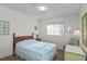 Cozy bedroom offering natural light, charming décor, and comfortable furniture at 2823 Cady Way, Winter Park, FL 32792