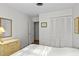 Bright bedroom features a closet, white walls, and traditional decor; a serene retreat at 2823 Cady Way, Winter Park, FL 32792