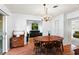 Dining room with hardwood floors, round table, and chandelier at 2823 Cady Way, Winter Park, FL 32792