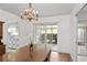 Dining room features access to the patio and a view into the kitchen at 2823 Cady Way, Winter Park, FL 32792