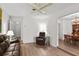 Comfortable living room with wood floors and access to the dining room at 2823 Cady Way, Winter Park, FL 32792