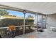 Screened-in patio offering bug-free enjoyment with a view of the backyard and surrounding greenery at 2823 Cady Way, Winter Park, FL 32792