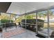 Cozy screened porch with a bench and patterned rug at 2823 Cady Way, Winter Park, FL 32792