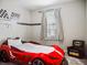 bedroom with a race car bed and Batman chair at 2949 Muller Oak Loop, Ocoee, FL 34761