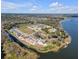 Aerial view of lakefront community with new homes and open space at 3019 Tackle Drive, Leesburg, FL 34748