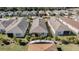 Aerial view of houses with gray and brown roofs at 308 Vestrella Dr, Kissimmee, FL 34759