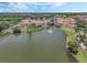 Aerial view of community clubhouse and lake at 308 Vestrella Dr, Kissimmee, FL 34759