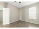 Spacious bedroom with tile floors and a door at 308 Vestrella Dr, Kissimmee, FL 34759