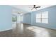 Spacious living room with light blue walls and tile floors at 308 Vestrella Dr, Kissimmee, FL 34759