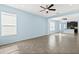 Bright living room with tile floors and open concept view to kitchen at 308 Vestrella Dr, Kissimmee, FL 34759