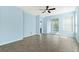 Open living space with tile floor, ceiling fan and sliding glass doors at 308 Vestrella Dr, Kissimmee, FL 34759