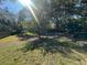 Large backyard with grass and trees at 3663 Lomond Ct, Apopka, FL 32712