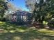 Backyard with screened patio and trees at 3663 Lomond Ct, Apopka, FL 32712