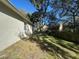 Spacious backyard with mature trees and a wooden fence at 3663 Lomond Ct, Apopka, FL 32712