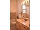 Clean bathroom with light wood cabinets and a bathtub at 3663 Lomond Ct, Apopka, FL 32712