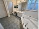 Double sink bathroom with bathtub and toilet at 3663 Lomond Ct, Apopka, FL 32712