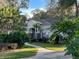 House exterior with stone accents and beautifully landscaped yard at 3663 Lomond Ct, Apopka, FL 32712