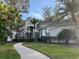 Two-story house with stone accents and lush landscaping at 3663 Lomond Ct, Apopka, FL 32712